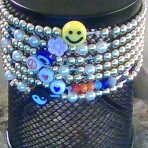 7 golden and charm bracelets